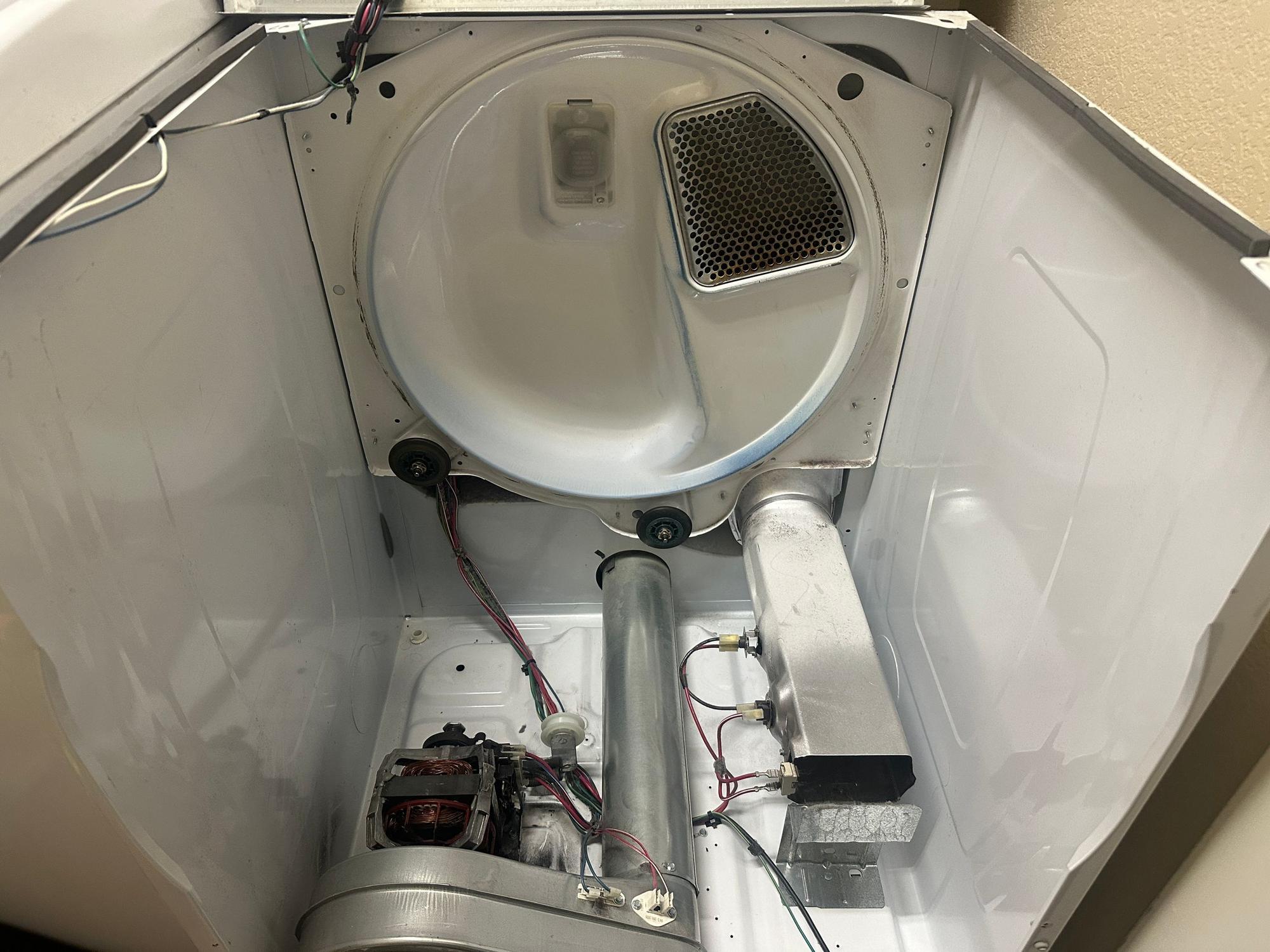 Same dryer cavity after professional cleaning. Drum, motor, and exhaust clear