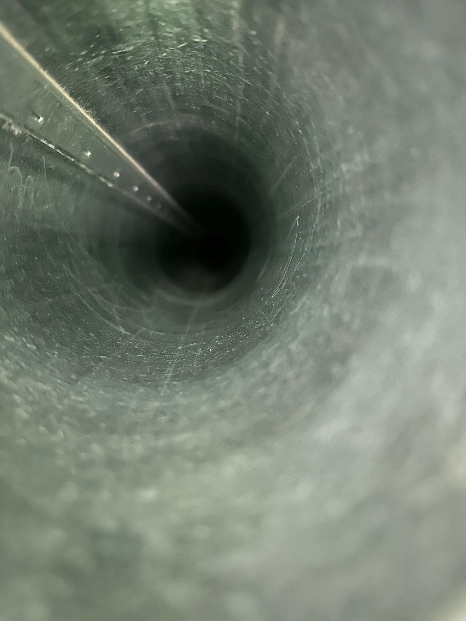 Same dryer vent after professional cleaning, clear airflow restored